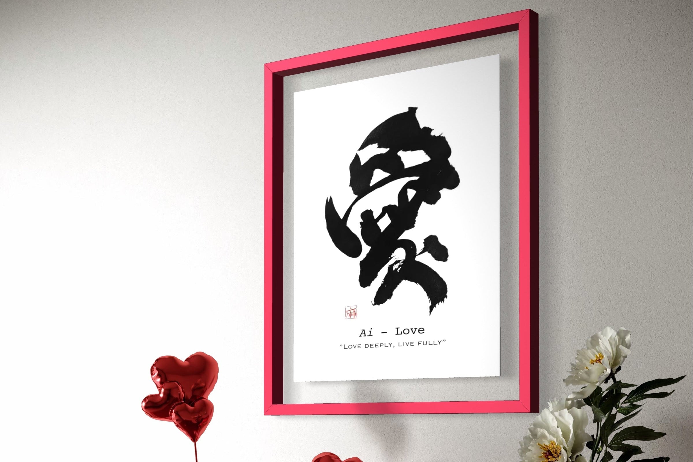 Framed artwork with a black and white design on a red cabinet with decorative items.