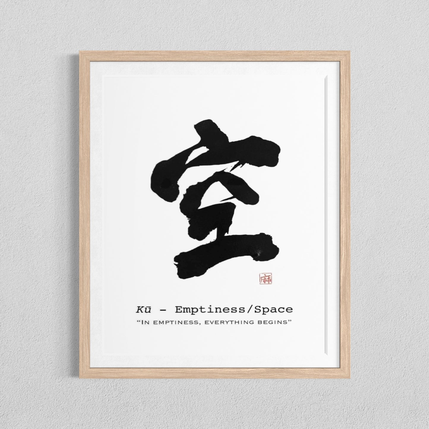 Framed artwork with black calligraphy and text on a white background - Ku (emptiness)