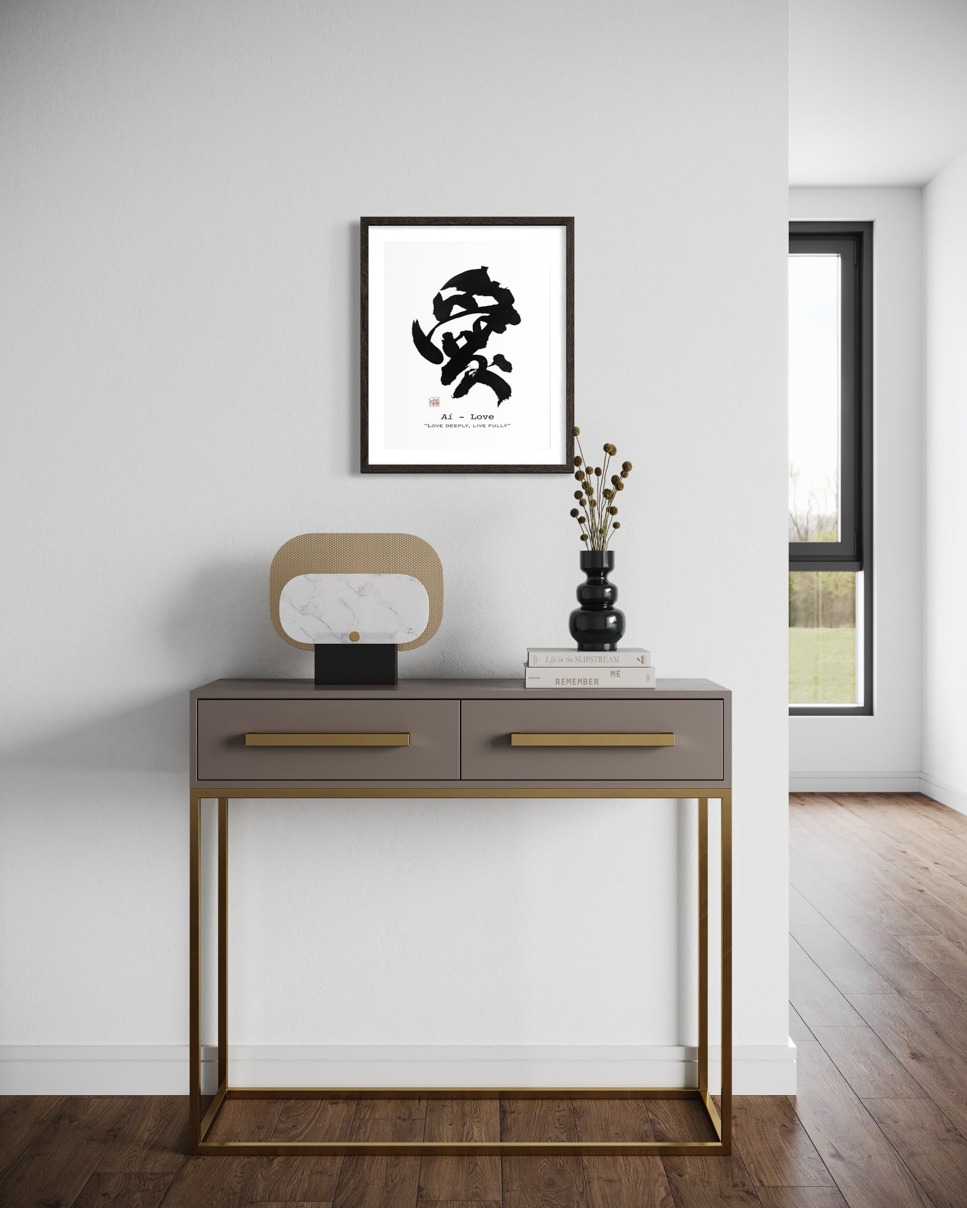Japandi interior with a console table and framed calligraphy artwork on a white wall.