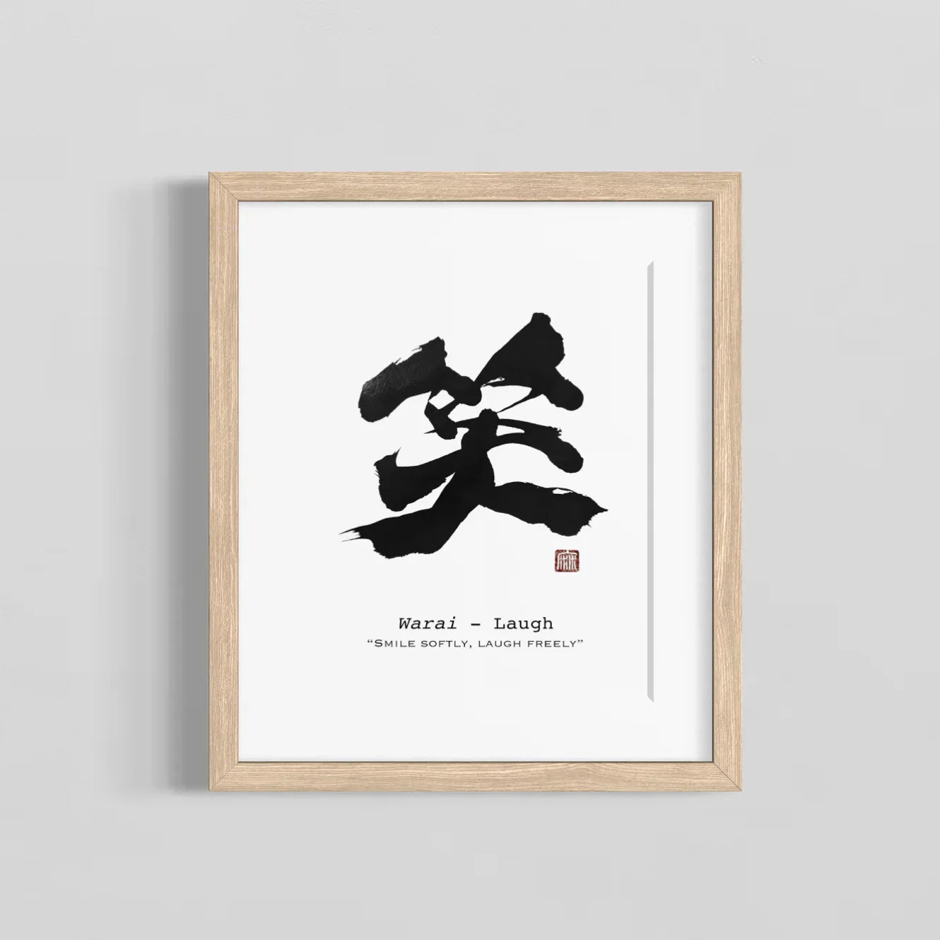Framed artwork with black calligraphy on a white background